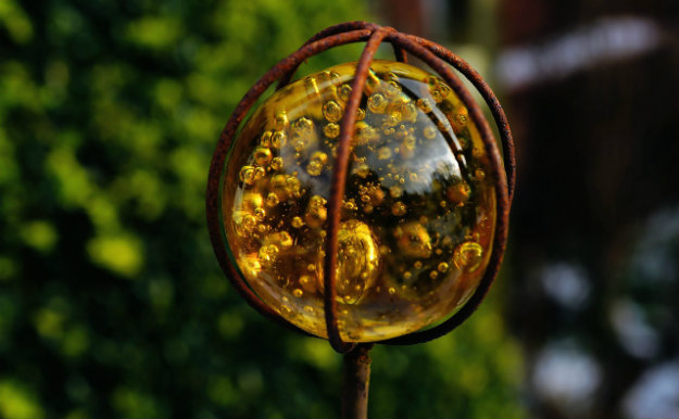 Unusual Garden Ornament - amber orb on a spike